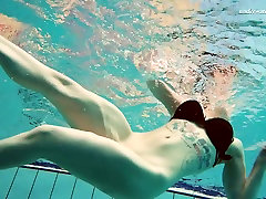 Busty pale skin young babe filmed absolutely naked underwater