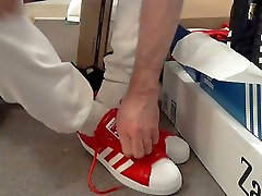 Putting on & unlacing new red Superstars for first time