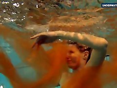 Yellow and Red clothed teen underwater
