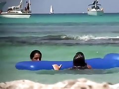 Topless sisters spied on an air mattress