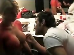 Busty blonde poses as a naked football player