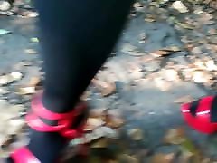 Lady L walking with sexy red high heels.