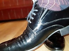 dressed in loss community shows my black shiny shoes