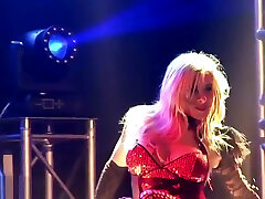 Busty milf stripper fucks dildo on stage