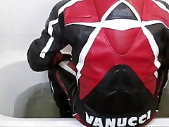 a bath in a one-piece vanucci leather suit