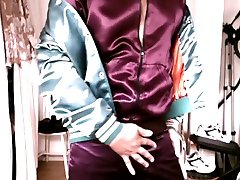 touching black corn with wifi in burgundy acetate satin jacket & jeans
