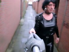 cd marylã¨ne in latex walking in rainy windy weather