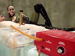 Latex Dominatrix Milks Slave Boy