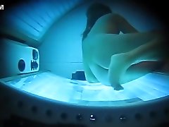 PEEPHOLE CAPTURES WIFE MASTURBATING IN TANNING BED