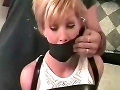 Cute Blonde in Leather Restraints