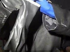 suit and blue gloves