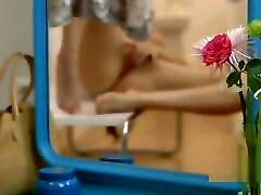 Splendid teen Josephine masturbates in the mirror