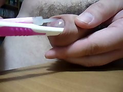 toothbrush and tongue cleaner under foreskin of my cock