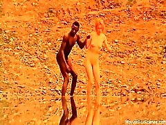 Hanne Klintoe emerging from a lake completely nude, showing