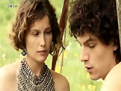 Laetitia Casta nude lying on her side in a field as Kate