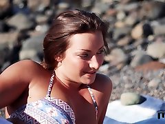 Slender bitch Alexis Cherry gives a blowjob on the beach before being fucked