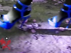 Lady L walking with blue high heels.