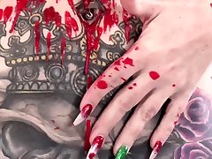 Tattooed babe Marie Bossette covers herself in hot wax