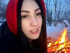 A guy and a girl fuck in the winter by the fire