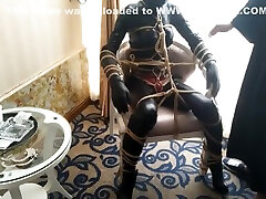 Latex Bondage In A Closet
