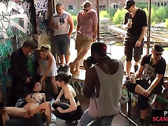 Bald slut in leather harness 3way DP fucked in public