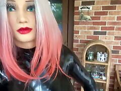 Rubber Doll Walking in Latex Catsuit with Big Silicone Boobs
