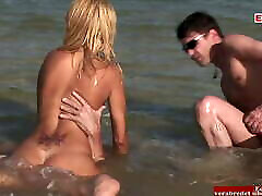 Outdoor anal threesome in a river with a skinny blonde