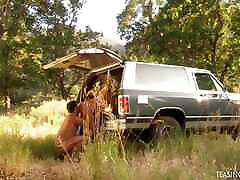 Outdoors the blonde with ponytails has her shaved pussy