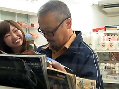 Japanese darling giving a good blowjob in the back of a car
