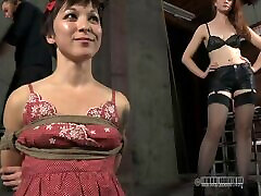Flexible slave tied lovely with ropes in BDSM shoot
