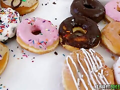 This busty babe makes those donuts look sweeter and shes sexy as fuck