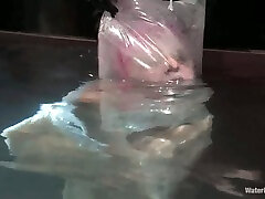 Cherry Torn the girl with pink hair in water bondage vid