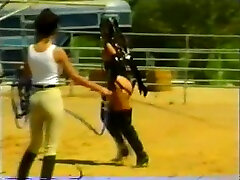 White chick in heavy black leather whatsapp status outfit restrained on the farm