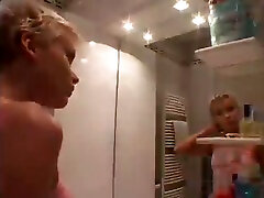 Beautiful blonde girlfriend gives head in the bathroom