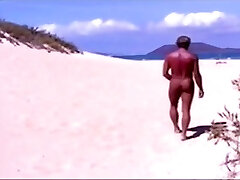 Tanned guy on beach in tiny string konde bit titi temporarily!