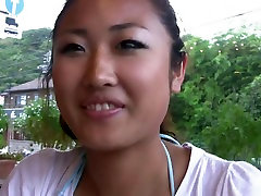 Cute girl is eating her breakfast smiling