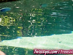 Sexy brunette masturbates by the pool