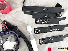 Fejira com Duct-taped woman in shiny leather jacket and swimsuit