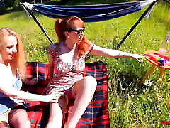 Red XXX and Lucy Gresty enjoy a picnic outdoors